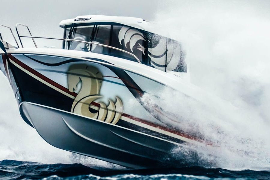 Stunning photograph of a Beneteau Barracuda 7 suspended over the water (2012 version).