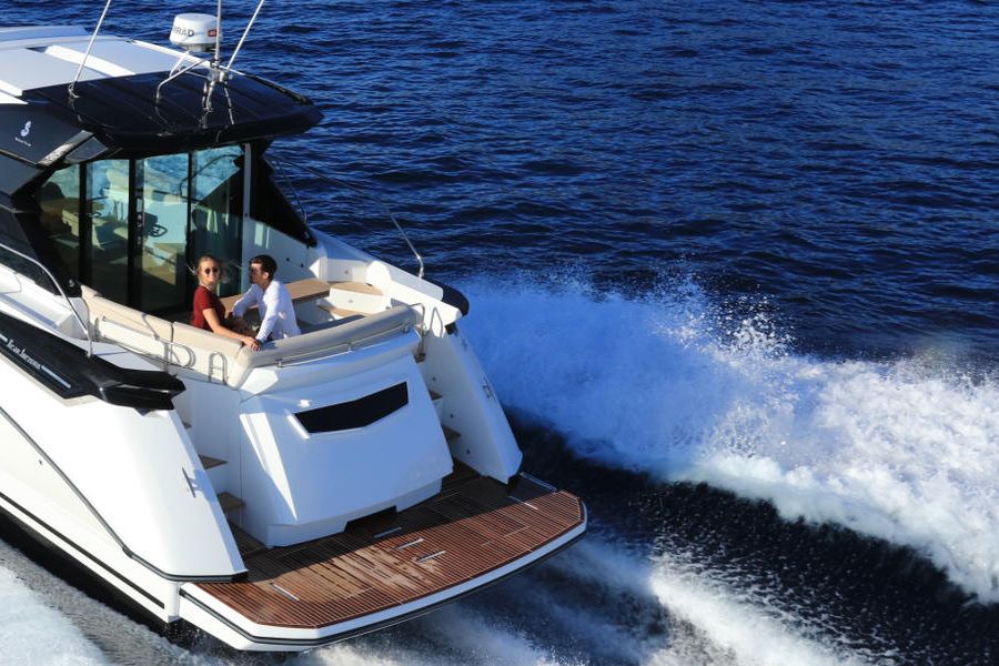 Back view of a Beneteau Gran Turismo 50 boat sailing at sea